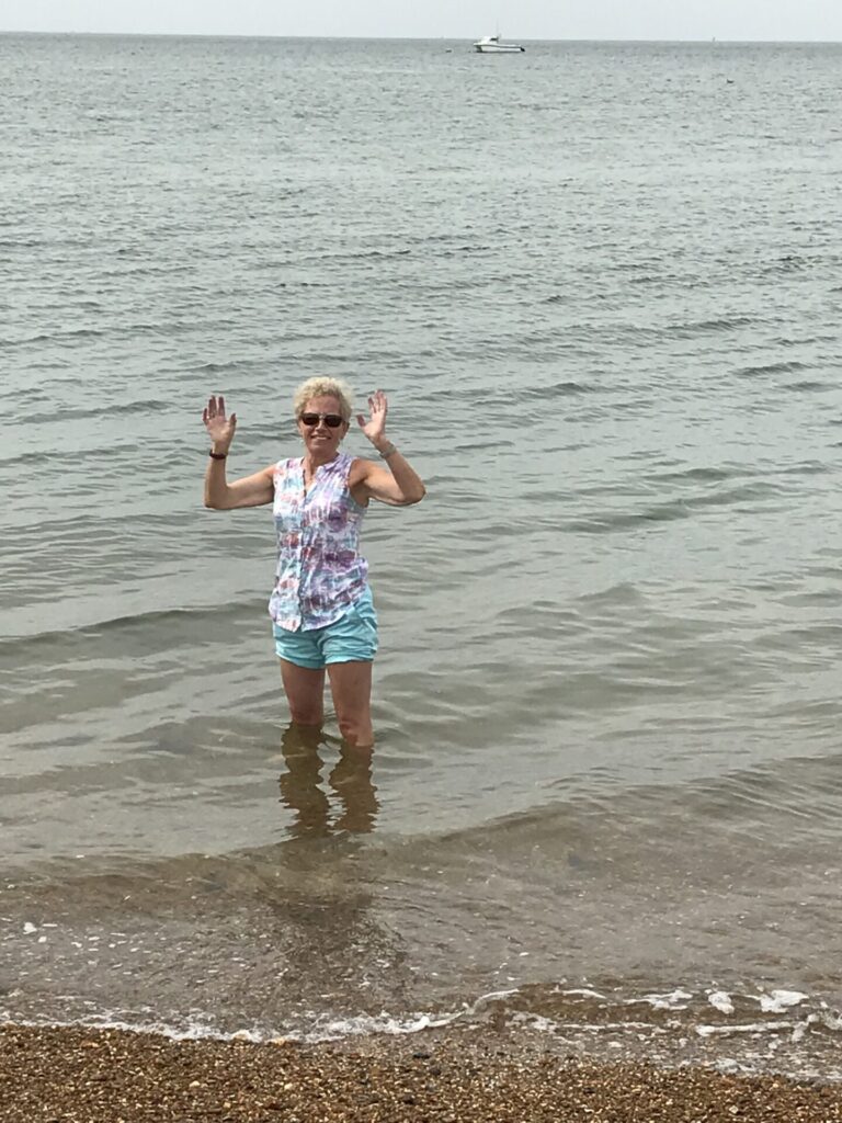 Lesley in the sea on trip to Whitstable
